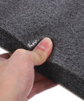 Close-up of a hand testing the tear resistance of Heavy Duty Black Epe Foam Boards Pack Of 4 Multi Use Foam Inserts for shipping.