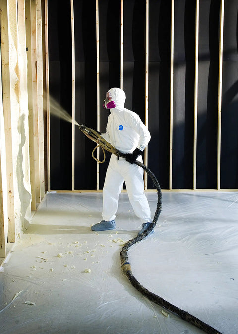 Worker in Disposable Protective Coverall With Elastic Cuffs, Attached Hood And Boots, White, Large, spraying foam