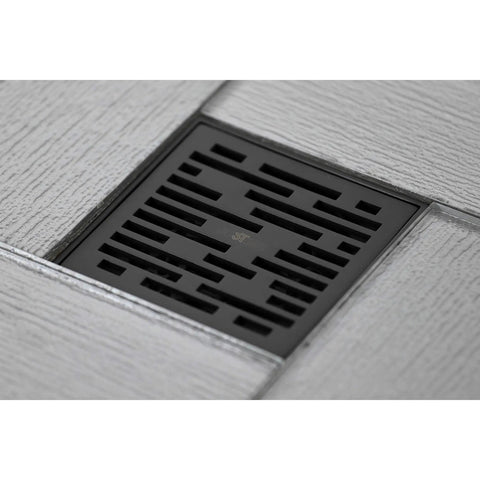 4 Inch Brass Square Grid Shower Drain With Hair Strainer in Oil Rubbed Bronze Finish, floor installed view.