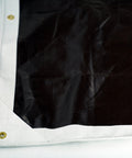 Corner view of Ultra Heavy Duty Waterproof Tarp 12 Ft By 16 Ft 16 Mil Thick With Rope Hem Reinforced Corners Brass Grommets