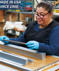 Kickass Flexible Metric Metal Ruler With Matte Black Chrome Coating And Heavy Duty Tempered Stainless Steel Frame in hands of a worker.