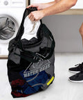 Large Mesh Tote Bag With Zipper For Swim Gear, Balls And Aqua Equipment shown used by a person near a laundry area.