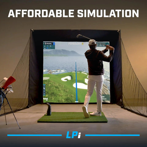 Golfer using All In One Indoor Golf Simulator Bundle With Pro Style Launch Monitor And FSX Play Gold Subscription, 1080p Projector, Enclosure And Turf Mat For Realistic High Accuracy Ball And Club Data At Home in a dark room.