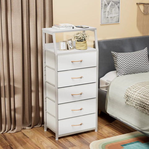 Five Drawer White Dresser With Wood Top And Steel Frame, Vertical Fabric Storage Tower beside a bed in a modern bedroom setting