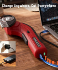 Katerk 4.4V Cordless Electric Scissors & Cardboard Cutter With 2pcs Blades charging via USB-C next to a laptop on a wooden surface.