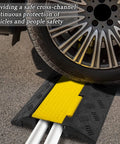 4 Pack 2 Channel Cable Ramp Kit With 11,000 Lbs Axle Capacity in use under car tire, black and yellow for driveway