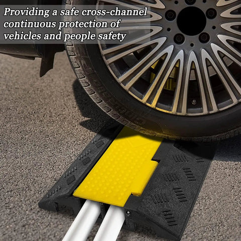 4 Pack 2 Channel Cable Ramp Kit With 11,000 Lbs Axle Capacity in use under car tire, black and yellow for driveway