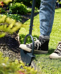 Person using Saw Tooth Lawn Edger With T Grip Handle For Long Reach 38 Inch Half Moon Edging Tool For Sidewalks And Gardens in garden