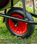 Front Brace For 6 Cubic Foot Wheelbarrows Fits True Temper Wheelbarrows Front Support Bracket And Axle Bracket Compatible With WB 1006 WB 1006FF WB 2006 WB 2006FF Tough As Nails Heavy Duty Easy Install Durable Steel Construction attached to wheelbarrow wheel on grass
