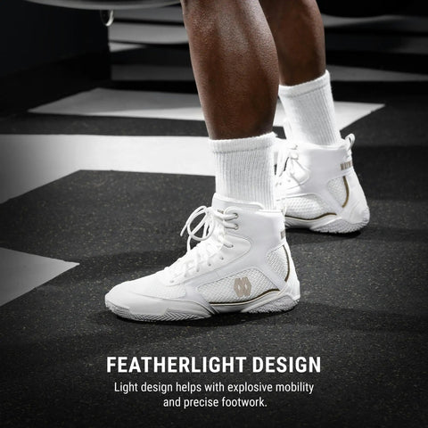 Mayweather Champ Boxing Shoes For Men And Women Unisex White Gold Mid Height Traction shown on legs with black floor background