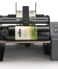 Hustle Ready Semi Automatic Label Applicator for Cylindrical Bottles, showing wine bottle with label, efficient setup for production.