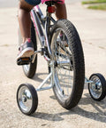 Adjustable Training Wheels For Kids Bike 14 16 18 Inches With Rust Resistant Steel Frame And Rubber Wheels Easy Install Pair For Stable Support And Smooth Rides On Any Frame attached to a bike in use