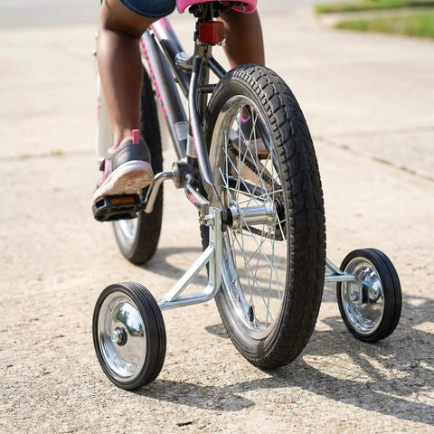 Adjustable Training Wheels For Kids Bike 14 16 18 Inches With Rust Resistant Steel Frame And Rubber Wheels Easy Install Pair For Stable Support And Smooth Rides On Any Frame attached to a bike in use