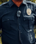 Officer wearing Remote Shoulder Speaker Microphone With Beefed Up Cable For Walkie Talkie Two Way Radio Compatible With CXT195 PX650