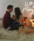 Couple sitting with 27.5 Inch Will You Marry Me Neon Sign With Dimmer Switch For Wedding Wall Decor 12V LED Neon Light