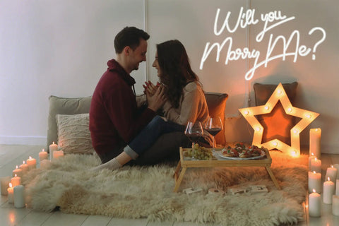 Couple sitting with 27.5 Inch Will You Marry Me Neon Sign With Dimmer Switch For Wedding Wall Decor 12V LED Neon Light