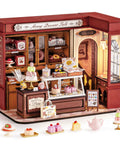 Vintage French Dessert Shop Miniature Dollhouse Kit With LED Light One 18 Scale Wooden Diorama Model For Adults Do It Yourself Craft Project Totally Cute Home Decor Gift For Boys And Girls on display with desserts.