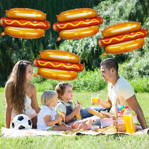 Family picnic with 7 Pack 28 Inch Hot Dog Balloons Foil Mylar Helium Balloons For BBQ Picnic Birthday Carnival Cookout Food Theme Party Decorations Durable Thickened Aluminum Foil Reusable Giant Food Themed Party Decor in the background.
