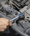 Quick Release Ratchet Wrench Set With One Quarter Inch Drive, Three Eighths Inch Drive, And One Half Inch Drive, 100 Tooth Mechanism, CrMo Steel Construction, Three Piece Set, Three Point Six Degree Swing For Tight Spaces, Boss Level Performance in use on car engine