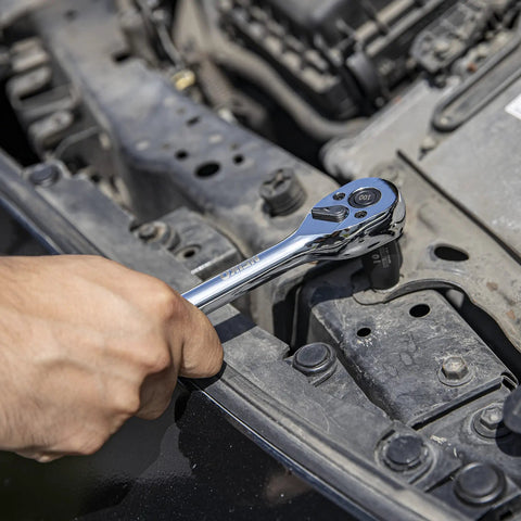 Quick Release Ratchet Wrench Set With One Quarter Inch Drive, Three Eighths Inch Drive, And One Half Inch Drive, 100 Tooth Mechanism, CrMo Steel Construction, Three Piece Set, Three Point Six Degree Swing For Tight Spaces, Boss Level Performance in use on car engine