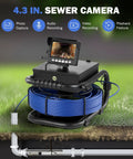 Drain And Sewer Inspection Camera with 100 ft cable, 4.3 inch LCD display showing underground image, coiled cable, grass background