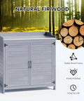 Outdoor Potting Bench With Metal Tabletop And Double Doors Cabinet, wooden frame in forest backdrop