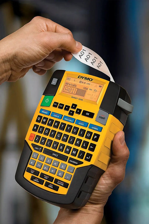 Person using Rhino 4200 Industrial Label Maker With Fast Printing One Touch Hot Keys Rugged Build For Tough Job Sites Pro Grade