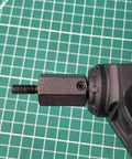 Close-up of Steel Hex Wheel Spacers Plus Twenty Mm Extended For Axial Scx6 One Sixth Scale Rc Crawler Truck on axle shaft.