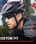 Cyclist wearing green tinted wraparound safety glasses with adjustable arms and no slip grips, UV 400 protection, ANSI Z87.1 rated.