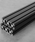 40120 T Slot Aluminum Extrusion Profile Black 600mm By 2 stacked on gray surface