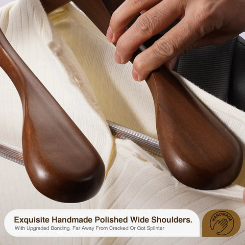 Six Pack Wide Shoulder Walnut Wooden Hangers with Heavy Duty Rotating Hooks Non Slip Pants Bar Smooth Finish Solid Wood Coat Hangers for Sweaters, Jackets, and Pants used in a closet setting.
