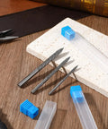 A Tough As Nails Three Piece Tire Reamer Drill Bit Set Featuring Sharp Carbide Burrs for flat tire repairs on a wooden surface.