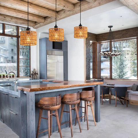 Total Vibe Hand Woven Rattan Pendant Light above kitchen island with wood bar stools, farmhouse decor and natural lighting.