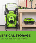 80V Self Propelled 21-Inch Cordless Lawn Mower with Brushless Motor in vertical storage position next to workbench