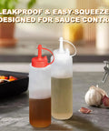 Two squeeze bottles from 5 In 1 Pro Grade Grill Tools Set With Insulated Meat Resting Blanket on kitchen counter.