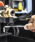 Hand using 12 Piece 1/4 Inch Drive 6 Point Stubby Metric Socket Set With Low Profile Design in tight engine space