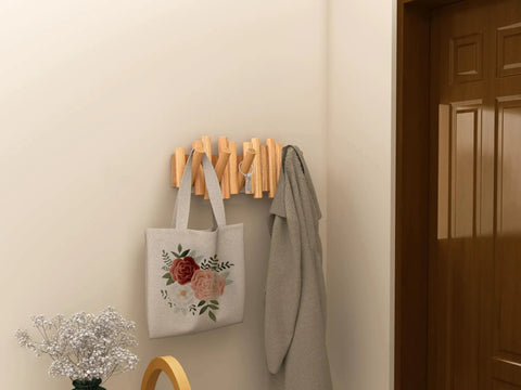 Foldable Wall Coat Rack With Five Hidden Hooks, modern wooden wall mount holding a bag and coat in a narrow hallway.