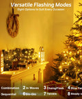 Outdoor Solar Fairy Lights Waterproof 16.4 Ft 50 LEDs String Lights For Patio Backyard Garden 8 Modes Two Pack Warm White Glow Holiday Decor For Christmas Halloween illuminating a festive room with a decorated Christmas tree.