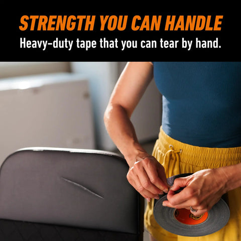 Person using Heavy Duty Black Duct Tape 1.88 Inch By 50 Yard Indoor Outdoor Weather Resistant With Reinforced Backing And Double Thick Adhesive.