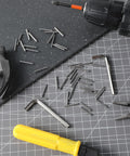Spring Hinge Tension Pin Replacement Kit With 40 Stainless Steel Shelf Pins And 2 Hex Wrenches on a work surface