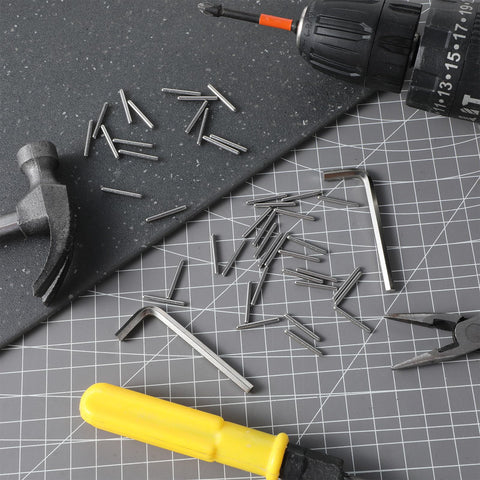 Spring Hinge Tension Pin Replacement Kit With 40 Stainless Steel Shelf Pins And 2 Hex Wrenches on a work surface