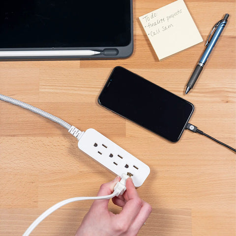Hand plugging device into 5 Pack 3 Outlet Power Strip With Surge Protection Grounded Flat Plug 6 Inch Designer Braided Cord White Gray Chevron UL Listed.