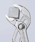 Cobra Pliers With One Hand Quick Adjust Pinch Guard 27 Position Fine Adjustment Hardened Teeth And Secure Locking Catch holding metal cube