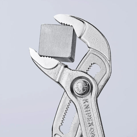 Cobra Pliers With One Hand Quick Adjust Pinch Guard 27 Position Fine Adjustment Hardened Teeth And Secure Locking Catch holding metal cube
