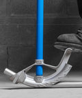Ideal Electrical 74-032 Aluminum Bender Head For 3/4 Inch Conduit Pipe in use on a blue conduit, showing foot placement.