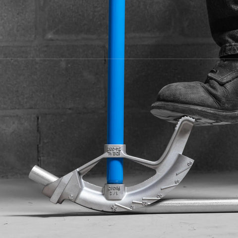 Ideal Electrical 74-032 Aluminum Bender Head For 3/4 Inch Conduit Pipe in use on a blue conduit, showing foot placement.