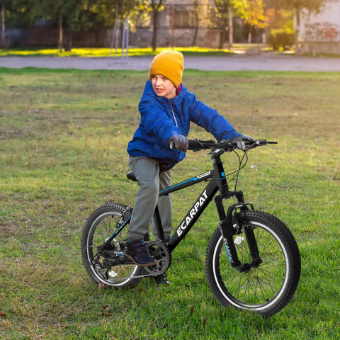 Child riding Kids Mountain Bike 20 Inch With 7 Speed Drivetrain, Front Suspension Fork and Disc Brakes in park setting