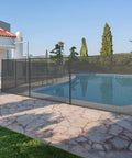 Mesh Pool Safety Fence For Inground And Above Ground Pools 4 Ft By 12 Ft With Stainless Steel Feet Weatherproof Outdoor Garden Fence Keeps Kids Safe And Pets Out Black installed around pool.