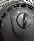 Close-up of Industrial Grade 20 Inch High Velocity Pivoting Floor Fan speed control dial for powerful air circulation