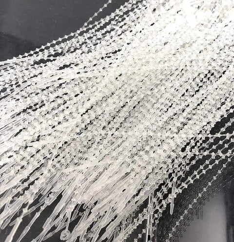 Keep Your Shop Floor Locked Down With These 1000 Clear Beaded Cable Ties Featuring Quick Snap Pin Locks, durable plastic fasteners.